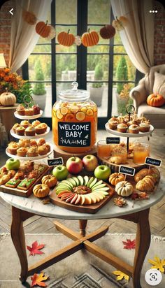 a table topped with lots of different types of desserts and pastries next to a window