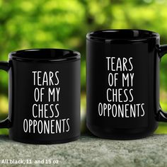 two black coffee mugs that say tears of my chess opponents and tears of my opponent