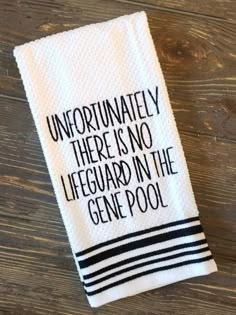 a hand towel that says, unfortunately there is no lifeguard in the gene pool