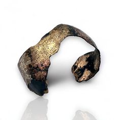 Metal Bracelet - This gracefully flowing steel cuff is fused with multiple powdered metals, including 18k gold, gold/bronze, copper, and champagne brass; the metals flow together on the surface, creating a multi-color veil while the black patina accentuates the various colors of the fused metals. Metallic Bracelet, Color Veil, Keum Boo, Copper Cuff Bracelet, Copper Cuff, Metal Bracelet, Sticks And Stones, Artful Home, Metal Bracelets