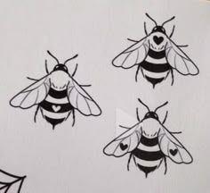 three bees with hearts on their backs and one is drawn in the shape of a heart