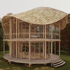 a wooden structure in the middle of a grassy area with stairs leading up to it