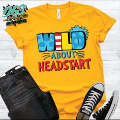 a t - shirt with the words wild about headstart on it next to jeans and sneakers