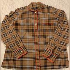 Burberry Blouse In Iconic Plaid With Neon Orange Trim Around Collar, Pocket, Cuffs And Placket. Small Split Hem. 100% Cotton. Perfect Shape. Worn Once. Burberry Blouse, Burberry Tops, Neon Orange, Split Hem, Black Tan, Black And Tan, Burberry, Split, Top Blouse