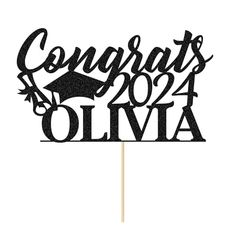 a graduation cake topper that says congratulations