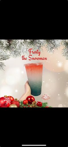 an advertisement for frosty the snowman with christmas decorations on it and a hand holding a cup