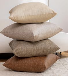 four pillows stacked on top of each other