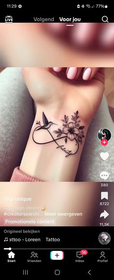 a woman's wrist tattoo with flowers and leaves on the left side of her arm