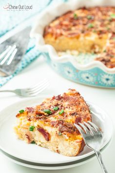 a piece of quiche on a white plate with a fork next to the casserole