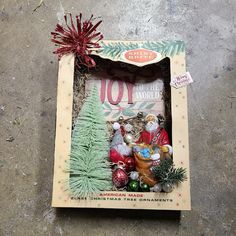 an old fashioned christmas tree ornament in a box