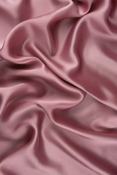 a close up view of a pink satin fabric