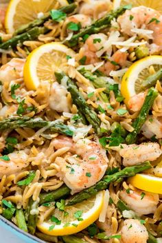 asparagus, lemon, and shrimp pasta in a blue bowl