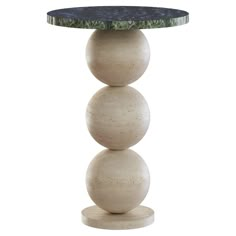 a table with three balls on it and a marble top in the shape of an egg