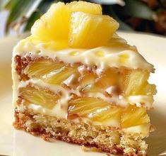 a piece of pineapple cake sitting on top of a white plate covered in icing