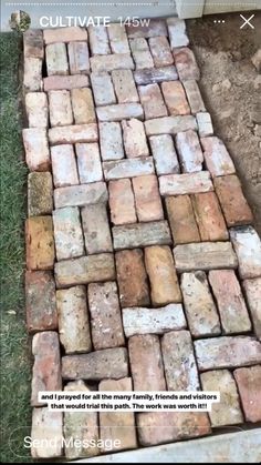 bricks laid out on the ground to make a walkway