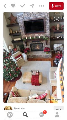 a living room filled with furniture and a christmas tree in the corner near a fire place