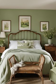 a bedroom with green walls and wicker bed frame in the middle, along with rattan chairs