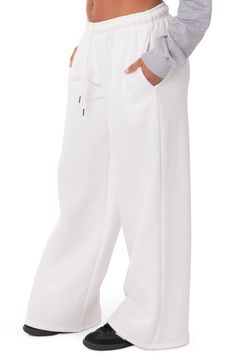 Let 'em know you're here for the drama in cotton-blend sweatpants fashioned with a low rise and wide leg. 50% cotton, 50% polyester Machine wash, line dry Imported White Straight Leg Leisure Pants, White Baggy Wide-leg Sweatpants, Casual White Cotton Wide Leg Pants, Sporty Wide Leg Cotton Pants, White Leisure Pants For Fall, White Pants For Leisure In Fall, Sporty Wide-leg Cotton Pants, White Straight Hem Bottoms For Fall, White Bottoms With Straight Hem For Fall