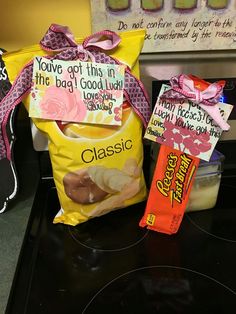 some candy bags are sitting on top of a stove with the words you've got this in the bag