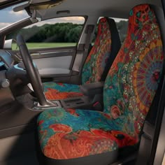 the interior of a car with brightly colored seat covers on it's front and rear seats