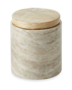 a white jar with a wooden lid on a white background