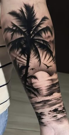 a man with a palm tree tattoo on his arm