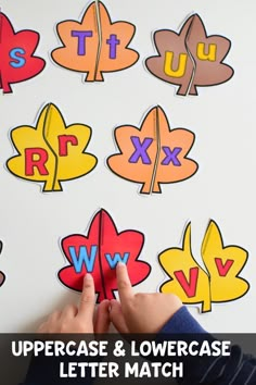 the uppercase and lowercase letter match is shown with hands holding up a piece of paper