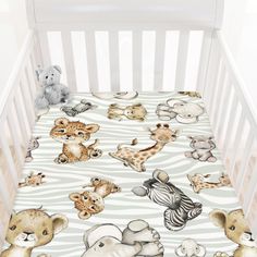 a baby crib with various animals on it