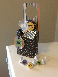 a bag with some candy in it sitting on top of a white table next to other candies