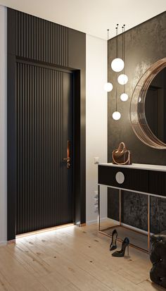 a black and white room with a large mirror on the wall