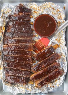 barbecue ribs on tin foil with bbq sauce