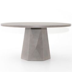 a round table made out of concrete on a white background