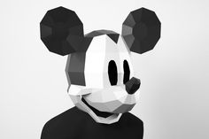 a black and white mickey mouse mask is featured in this low poly art work by artist mark mcinney