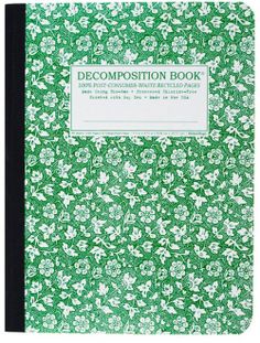 a green and white book with flowers on the cover, in front of a white background