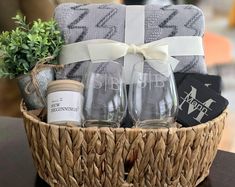 a basket filled with wine glasses and other items