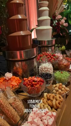 an assortment of desserts and pastries displayed on a table