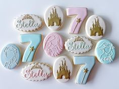 some cookies are decorated with royal and princess themed icing, including the number seven