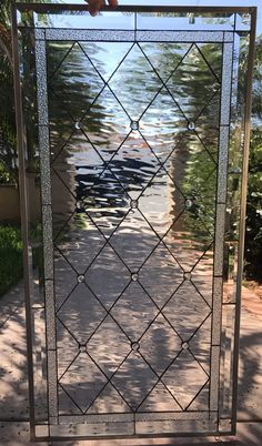 a metal gate with a man standing on top of it