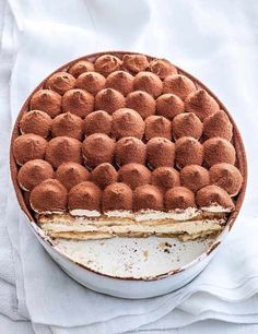 a cake that has been cut in half and is sitting on a white table cloth