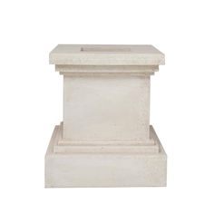 a white marble pedestal with a square base