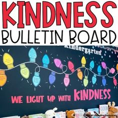 a bulletin board with lights on it and stuffed animals next to it that says, kindness bulletin board we light up with kindness