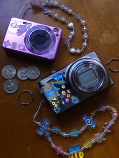 a camera and some beads on a table