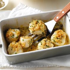 a casserole dish filled with shrimp and grits