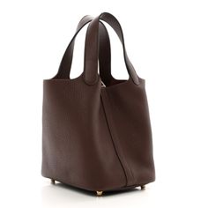 This is an authentic HERMES Taurillon Clemence Picotin Lock 18 PM in Havane. This chic tote is crafted of soft taurillon clemence calfskin leather in brown with reddish-purple undertones. This unique tote is a one-piece handbag with top handles that extend from the sides with an extra layer of leather for support. The top is open to a spacious brown suede interior with a leather base. Marble Print, Hermes Bags, Brown Suede, Calf Skin, Handles, One Piece, Purple, Leather