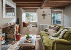 a living room filled with furniture and a fire place