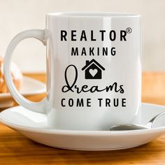 a white coffee mug with the words realtor making dreams come true on it