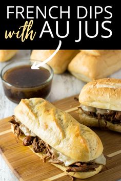 french dips with au jus on a cutting board