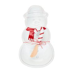 a plastic snowman with a red scarf and hat on it's head holding a wooden spoon