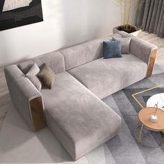 a living room with a sectional couch and coffee table