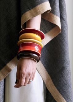 Design code: PBC-005-B Material: Sustainable wood, natural lacquer, and organic colors. Stacking up these bangles is one of our favorite go-to looks, all year around. Solo or stacked, cropped sleeves or rolled cuffs, handloom textiles, or linen tops- this is an evergreen design that you'll want in every color. Available in 8 color-ways. Dimensions: 2 cm wide. Size: XS= 2.25"diameter, S= 2.5” diameter, and M= 2.75” diameter Handcrafted | Natural | Sustainable | Non-toxic | Heritage Craft Please a Handmade Retro Bracelets, Wooden Objects, Retro Love, Wooden Bangle, Heritage Crafts, Organic Colors, Ring Pendant Necklace, Hair Ornaments, Wooden Jewelry